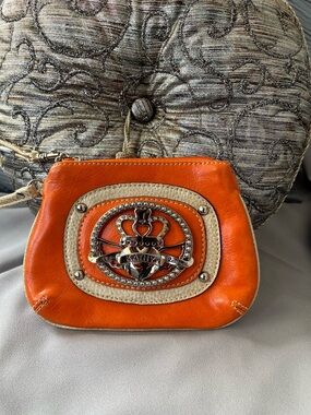 Kathy Van Zeeland Orange Wristlet with Silver Emblem EUC